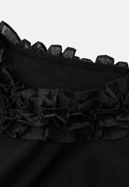 Short sleeve knit top with ruffled neckline