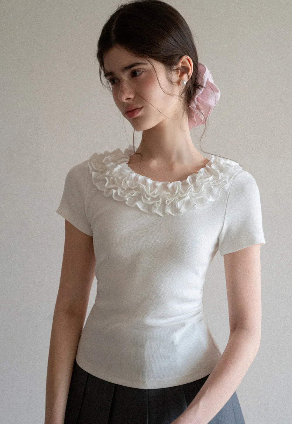 Short sleeve knit top with ruffled neckline