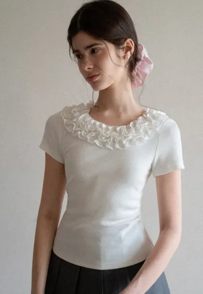Short sleeve knit top with ruffled neckline
