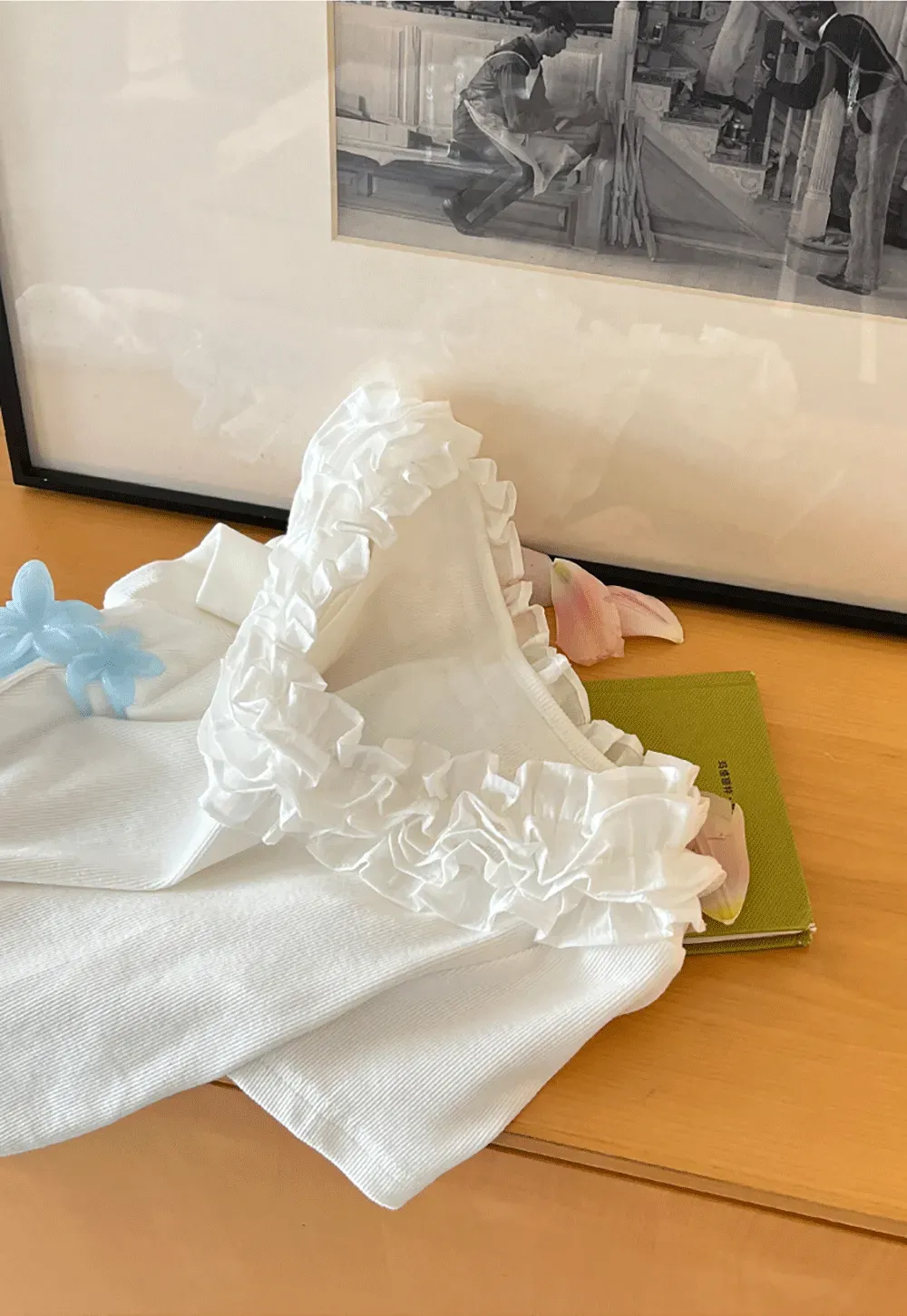 Short sleeve knit top with ruffled neckline