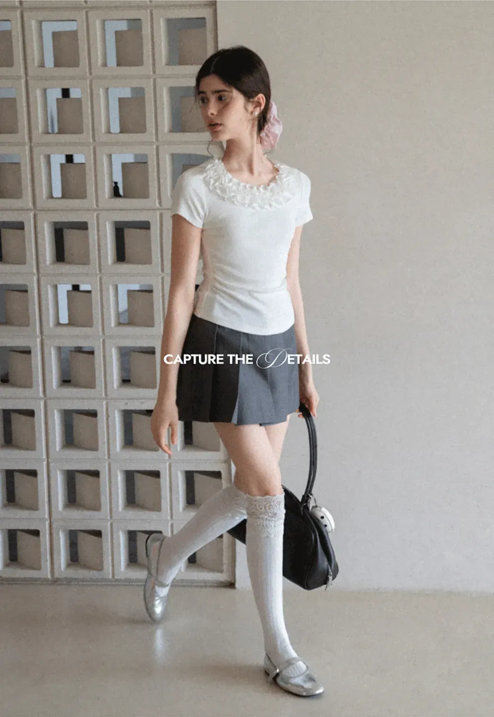 Short sleeve knit top with ruffled neckline