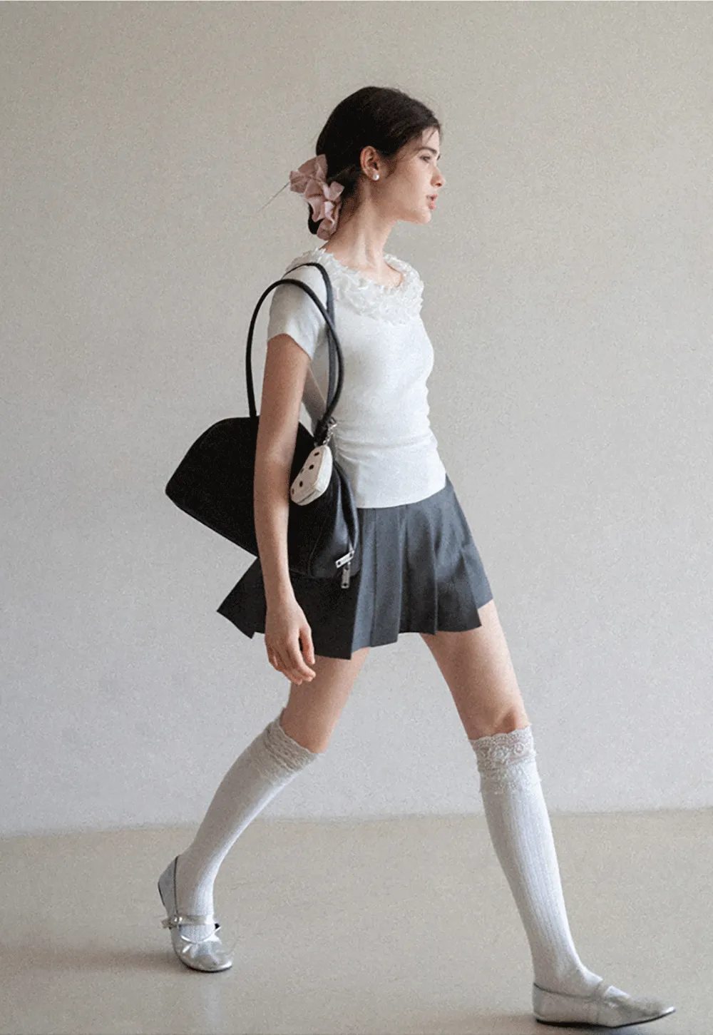 Short sleeve knit top with ruffled neckline