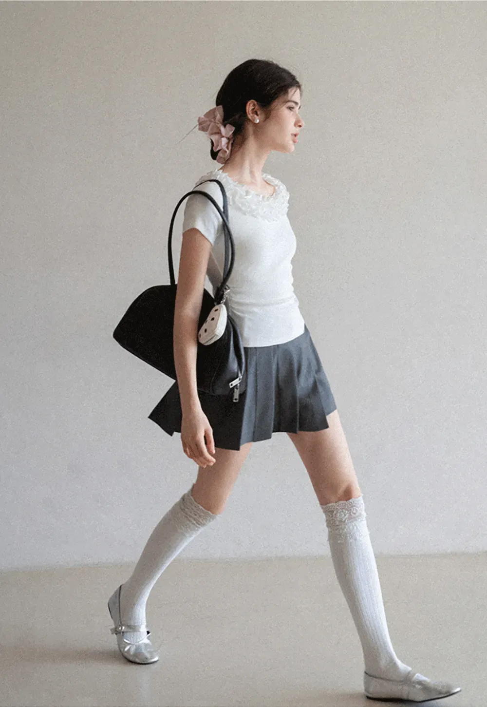 Short sleeve knit top with ruffled neckline