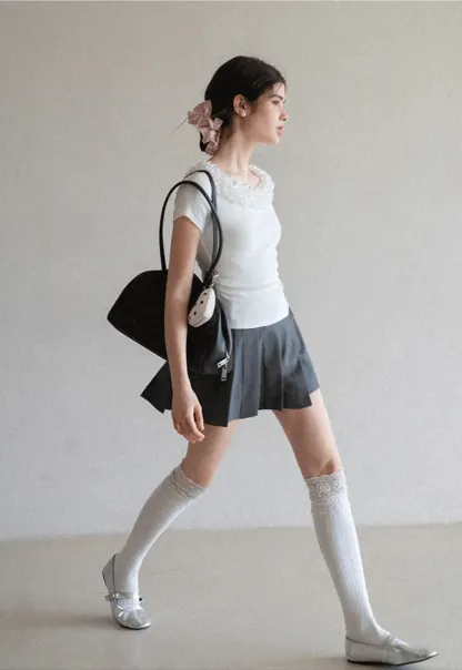 Short sleeve knit top with ruffled neckline