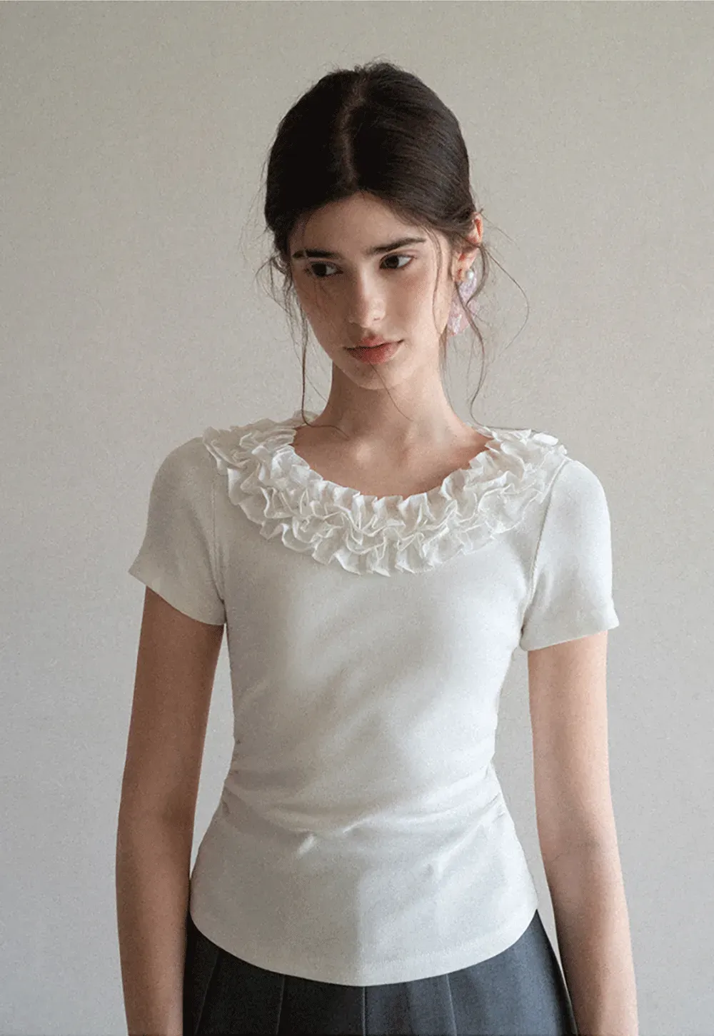 Short sleeve knit top with ruffled neckline