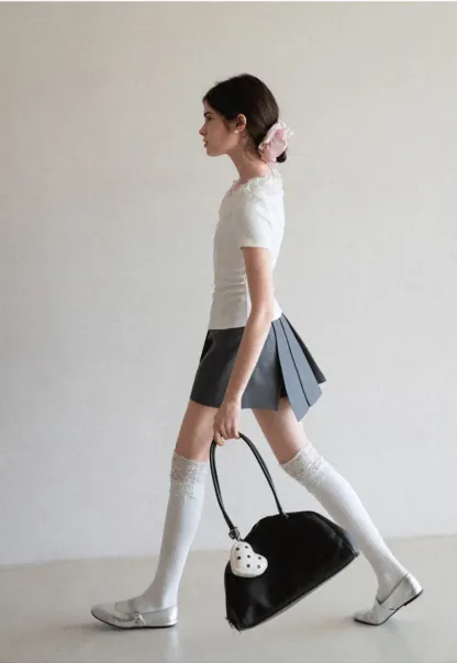 Short sleeve knit top with ruffled neckline