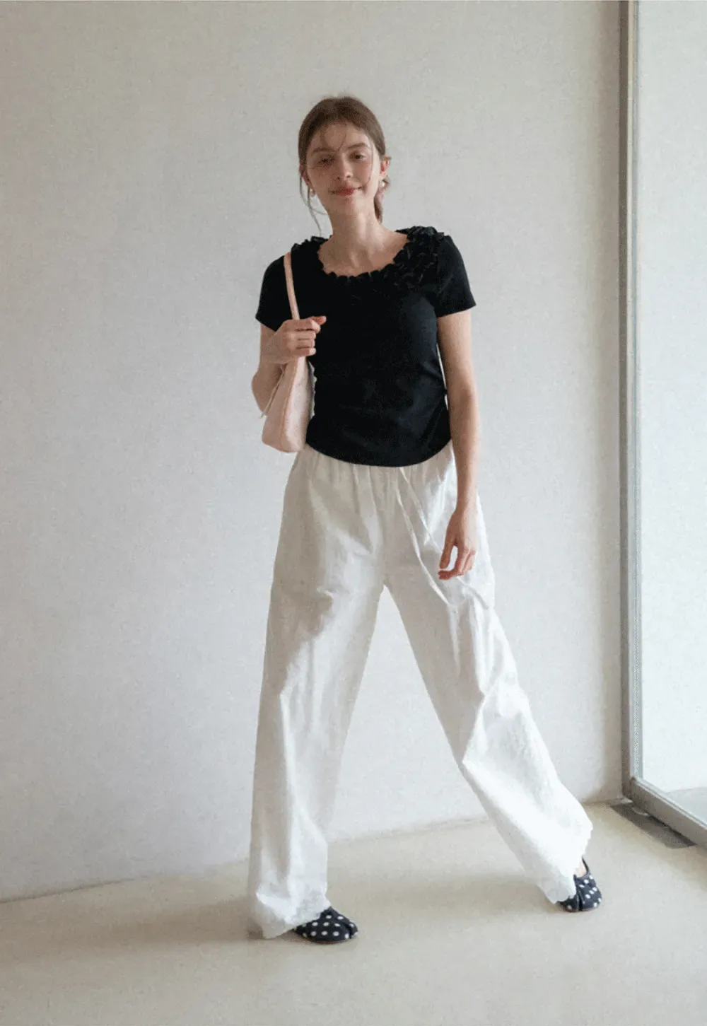 Short sleeve knit top with ruffled neckline