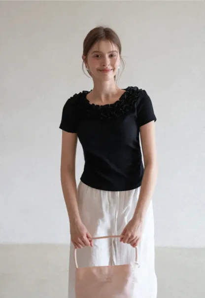 Short sleeve knit top with ruffled neckline
