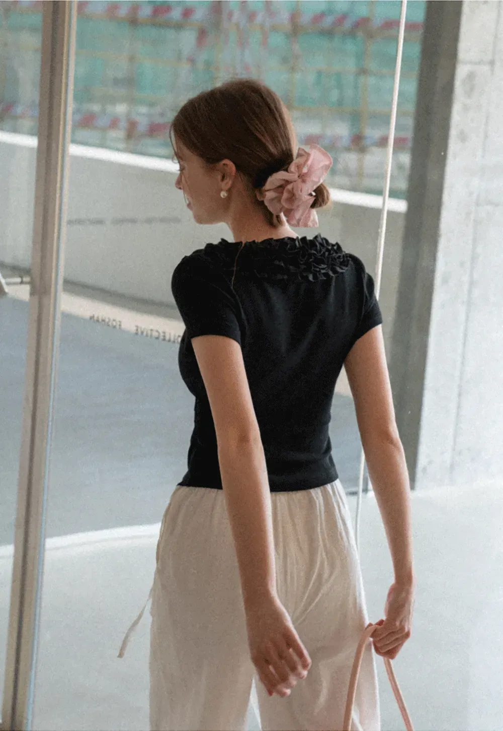 Short sleeve knit top with ruffled neckline