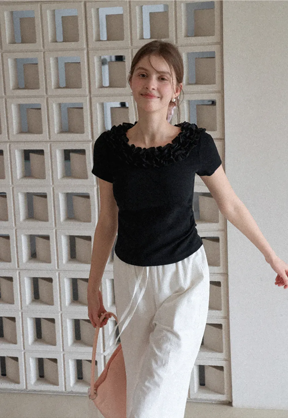 Short sleeve knit top with ruffled neckline