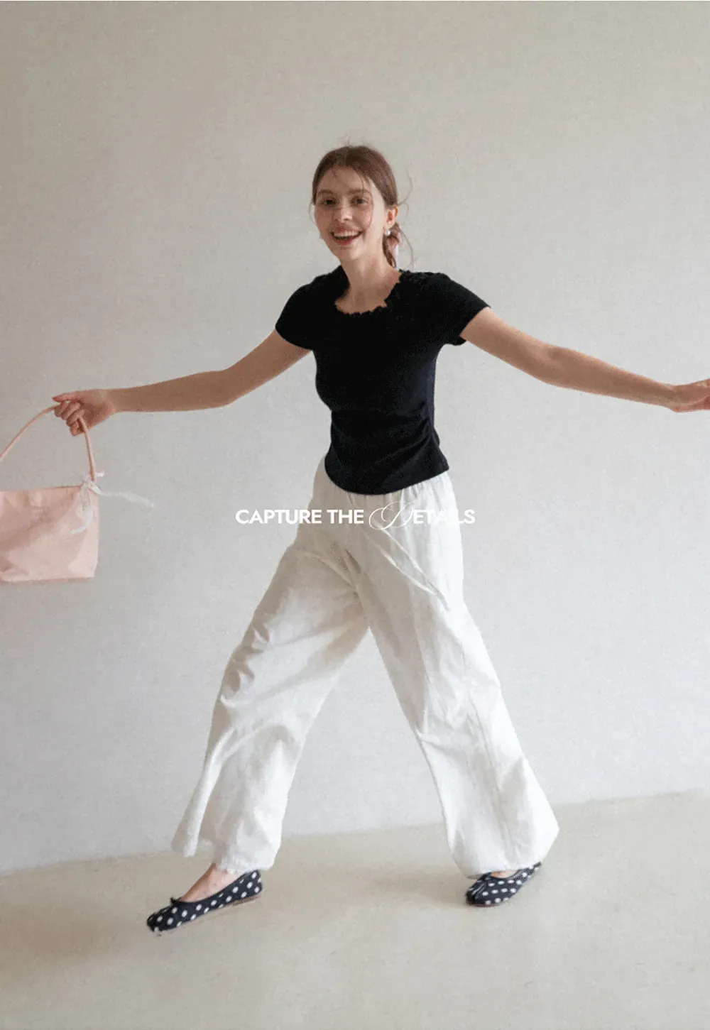 Short sleeve knit top with ruffled neckline