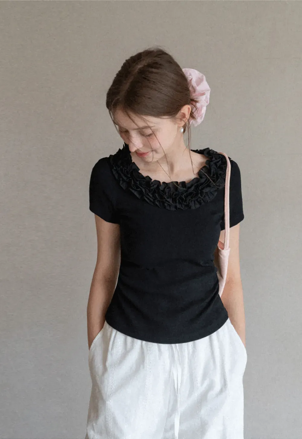 Short sleeve knit top with ruffled neckline