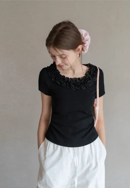 Short sleeve knit top with ruffled neckline
