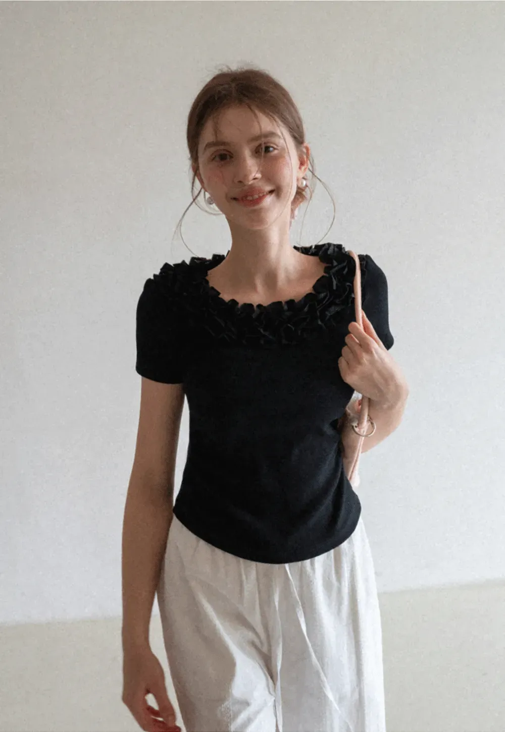 Short sleeve knit top with ruffled neckline