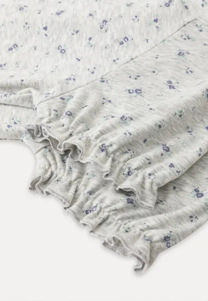 Short sleeve T-shirt with floral print and ruffled cuffs