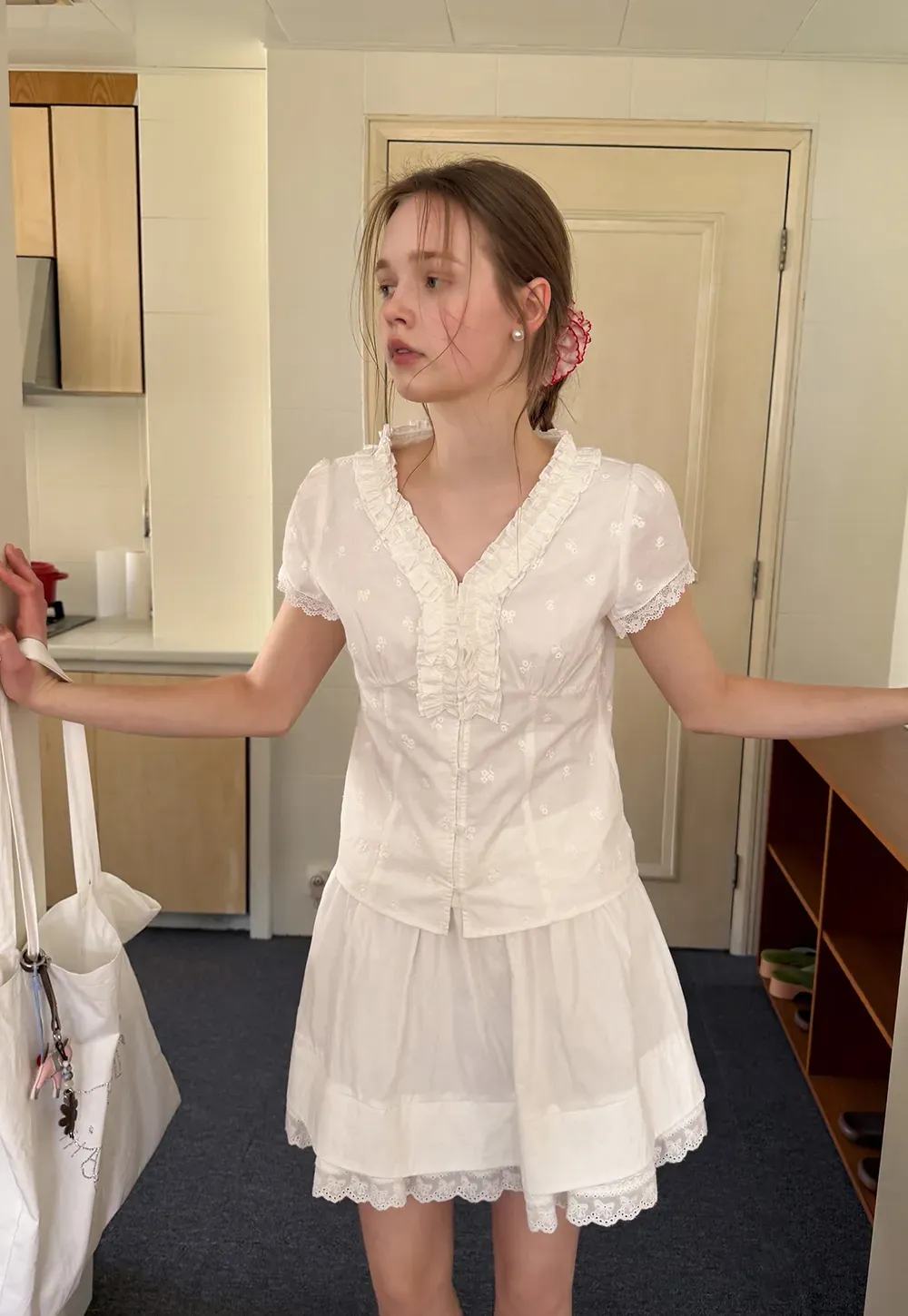 Embroidered short sleeve top with ruffled V neck and lace trim