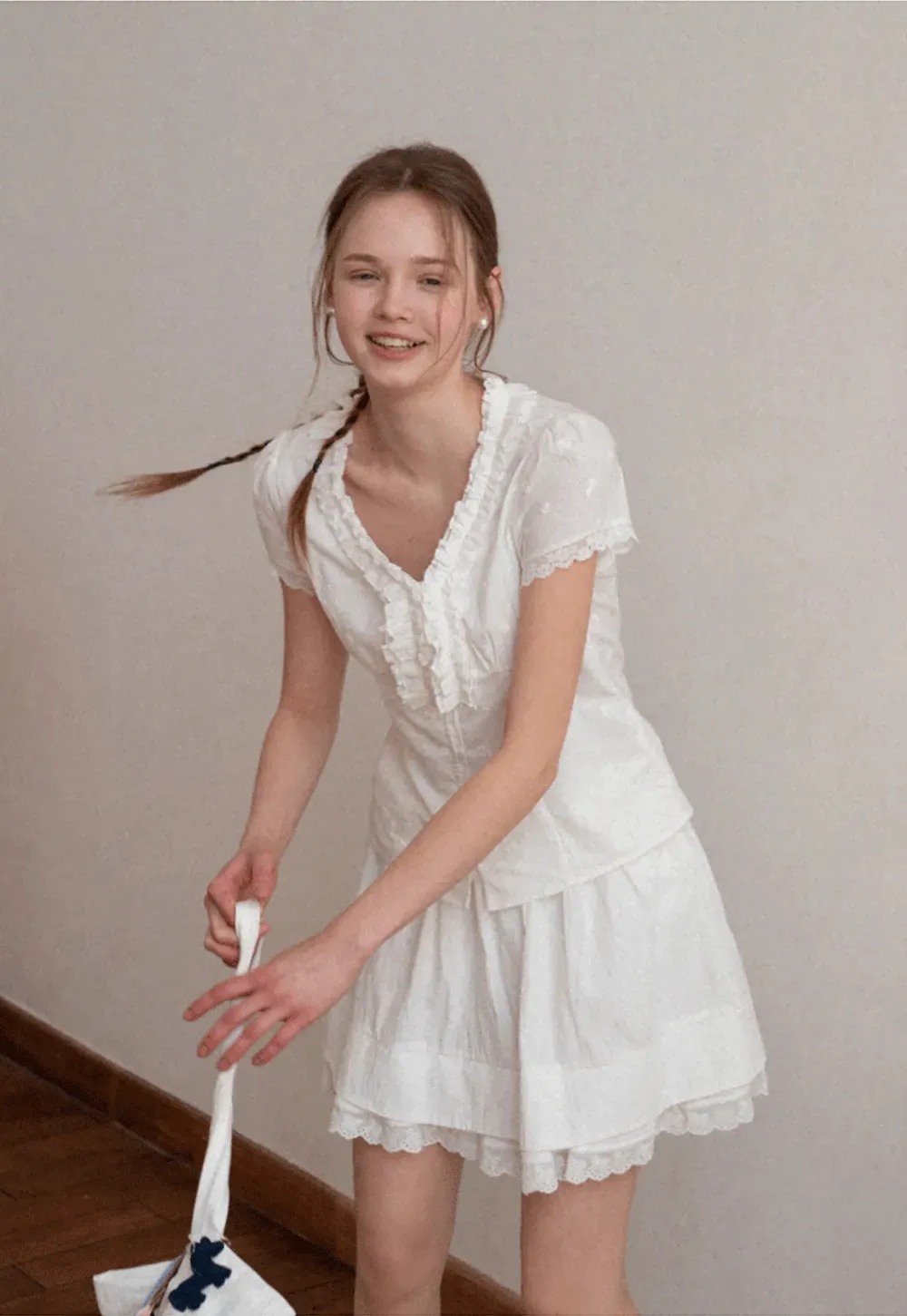 Embroidered short sleeve top with ruffled V neck and lace trim