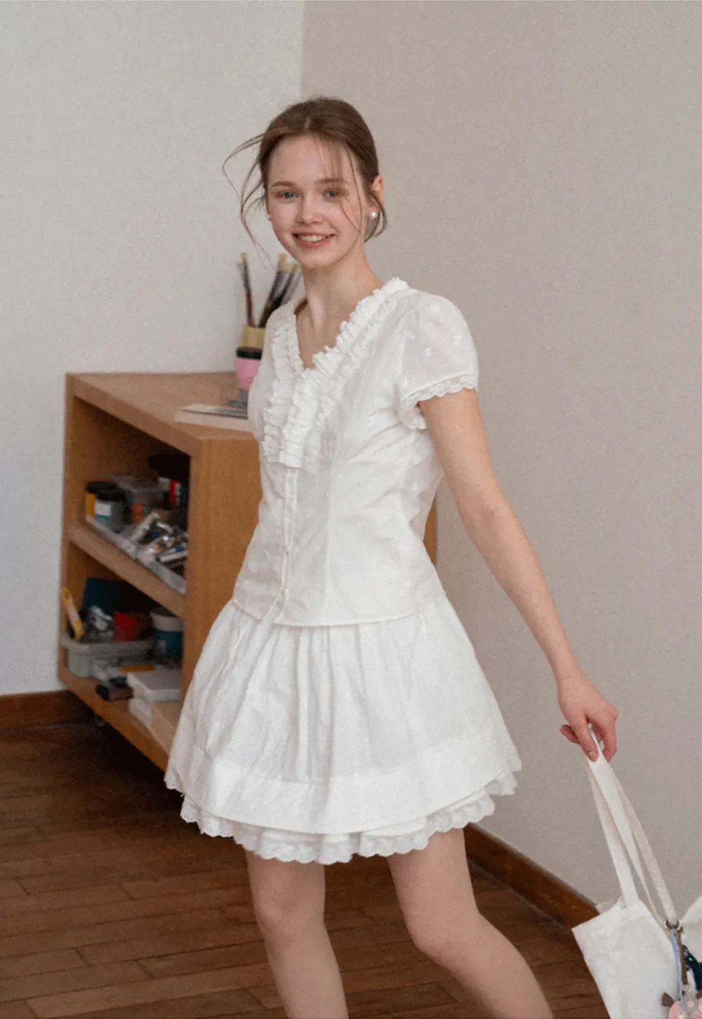 Embroidered short sleeve top with ruffled V neck and lace trim