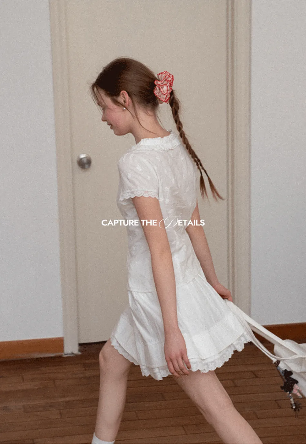 Embroidered short sleeve top with ruffled V neck and lace trim