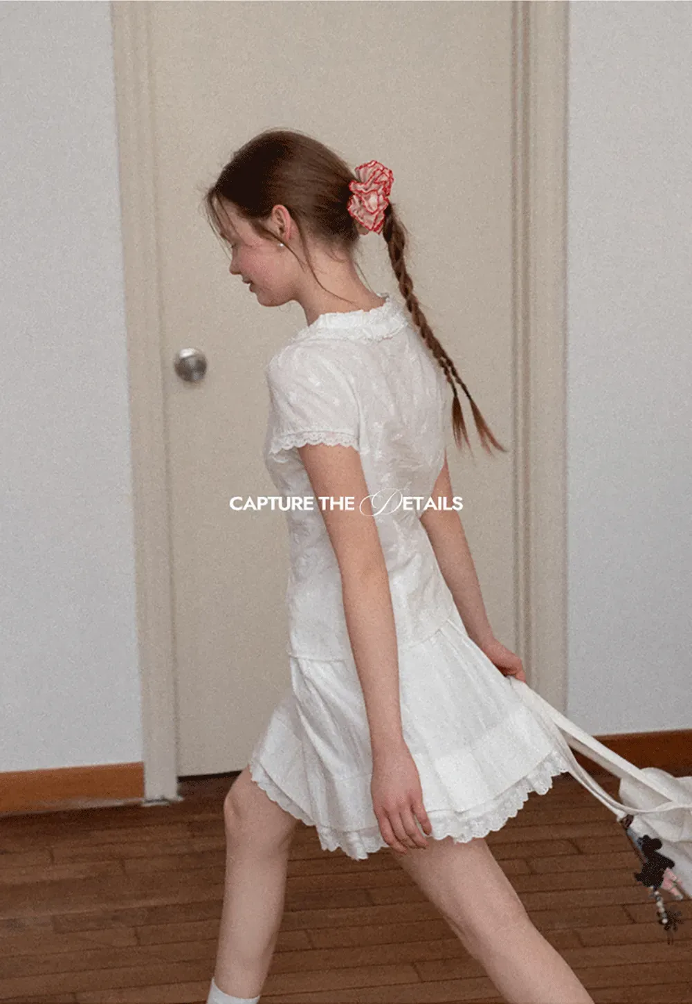 Embroidered short sleeve top with ruffled V neck and lace trim