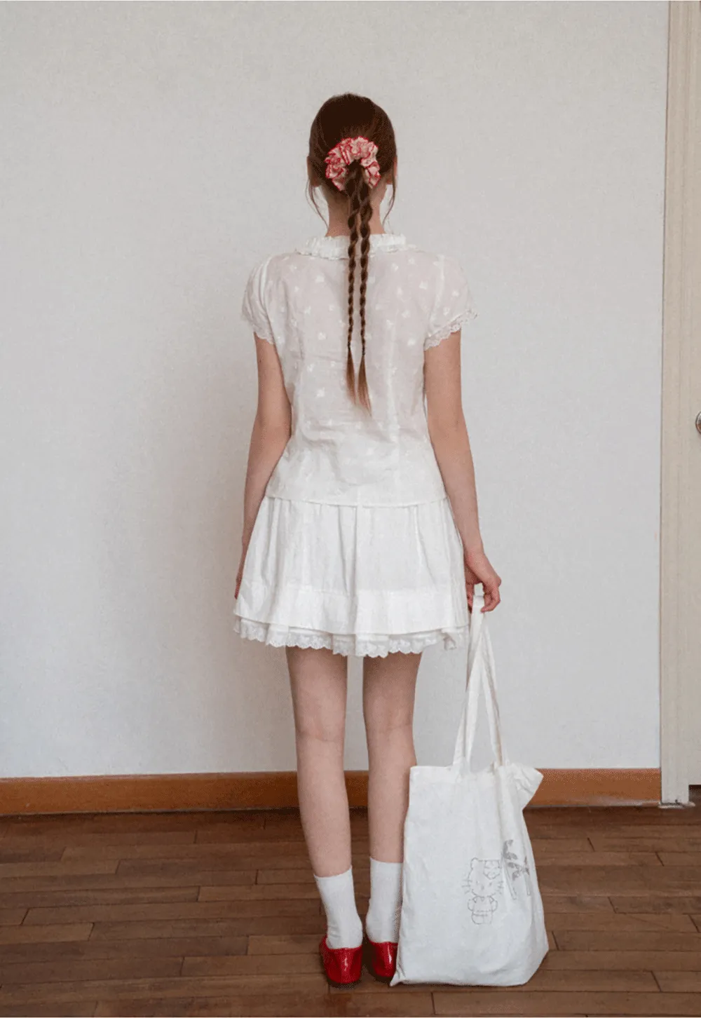 Embroidered short sleeve top with ruffled V neck and lace trim