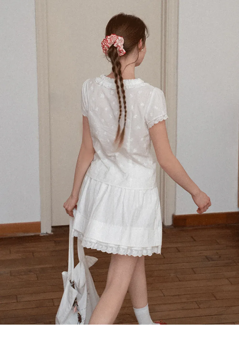 Embroidered short sleeve top with ruffled V neck and lace trim