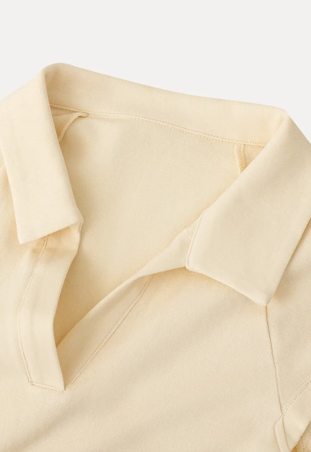 Sleeveless polo neck knit top