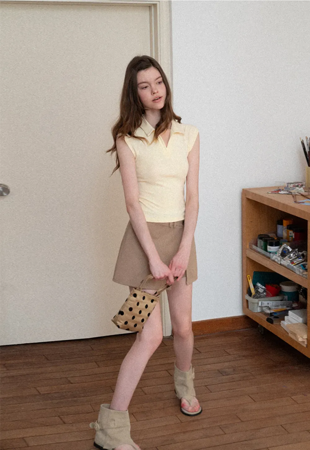 Sleeveless polo neck knit top