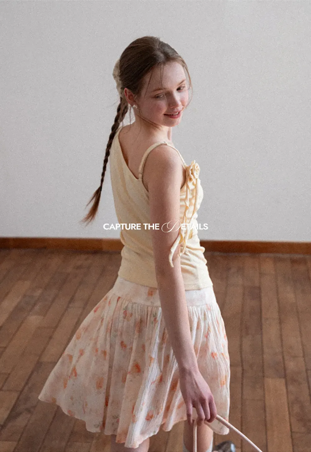 Asymmetrical draped tank top with tie detail