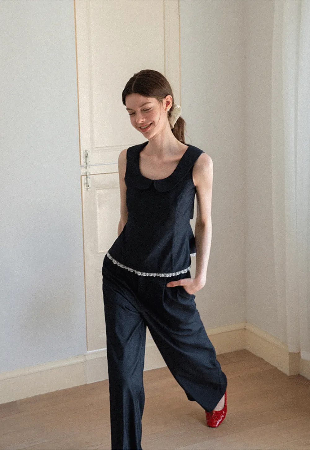 Cropped Sleeveless Top With Open Back Detail And High Waist Wide Leg Pants