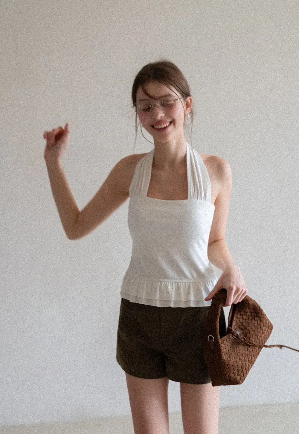 Halter neck tank top with ruffled hem