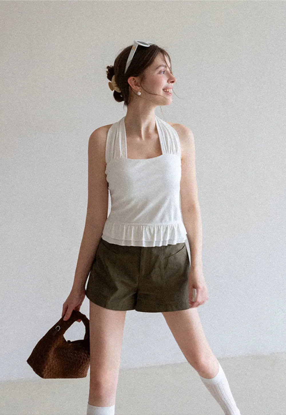 Halter neck tank top with ruffled hem