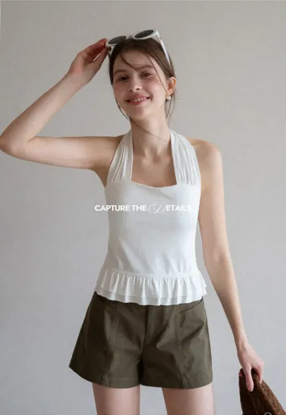 Halter neck tank top with ruffled hem