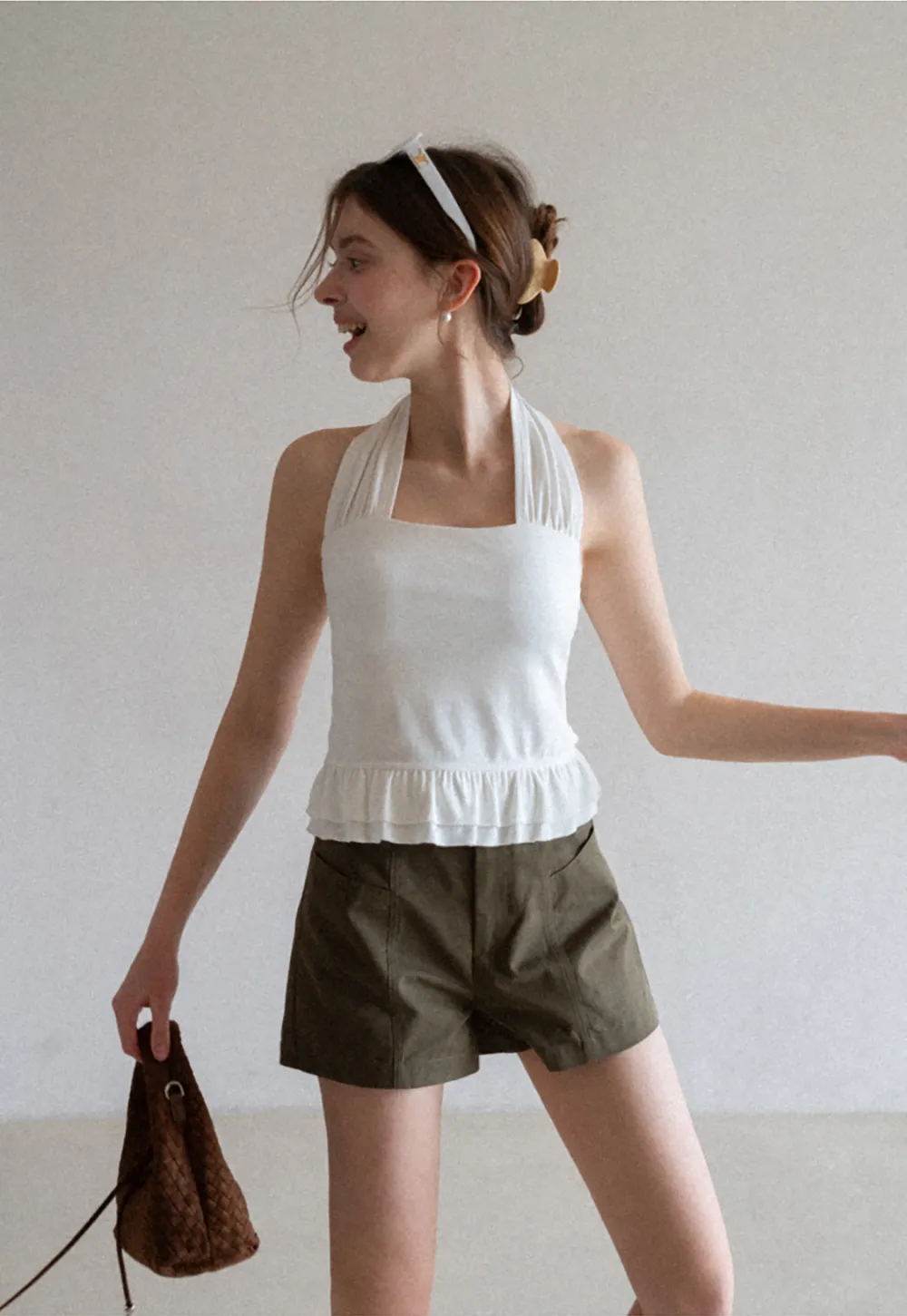 Halter neck tank top with ruffled hem