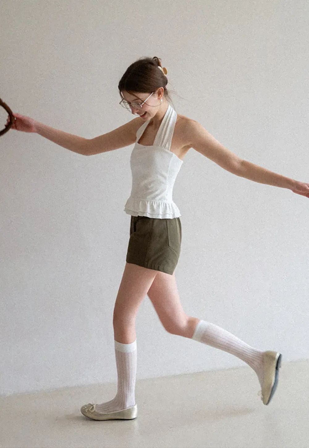 Halter neck tank top with ruffled hem