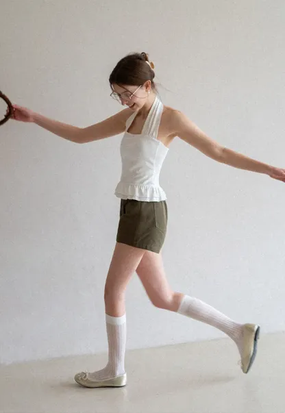 Halter neck tank top with ruffled hem