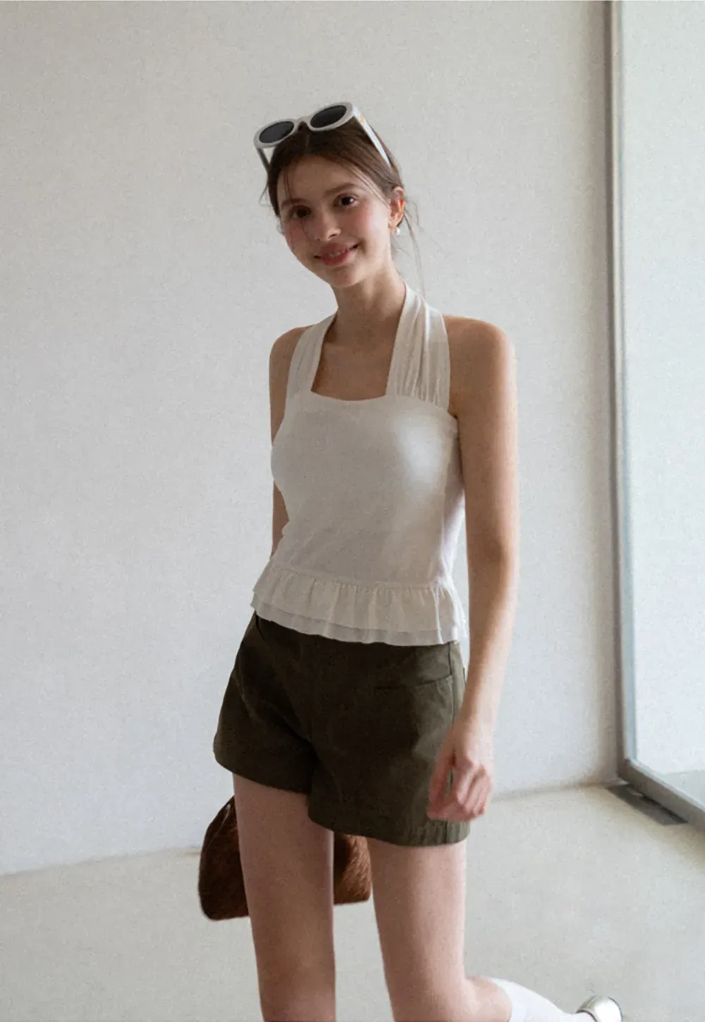 Halter neck tank top with ruffled hem