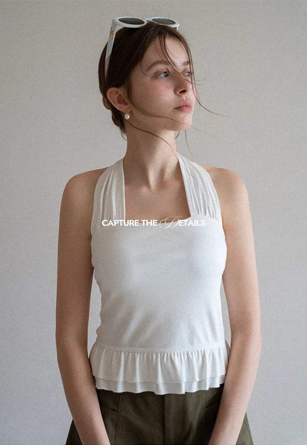 Halter neck tank top with ruffled hem