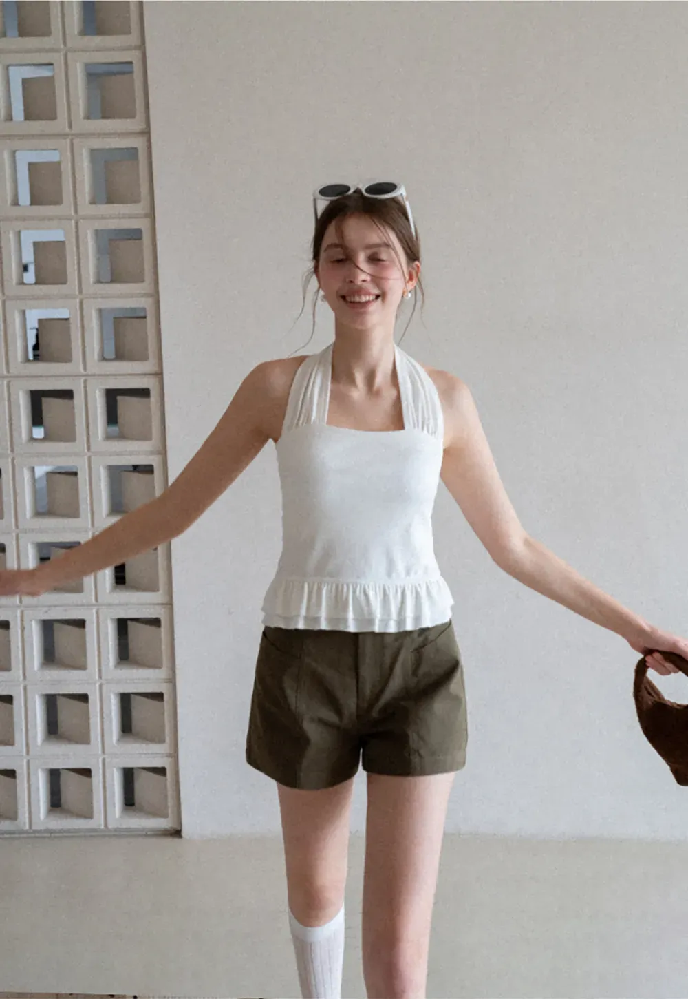 Halter neck tank top with ruffled hem