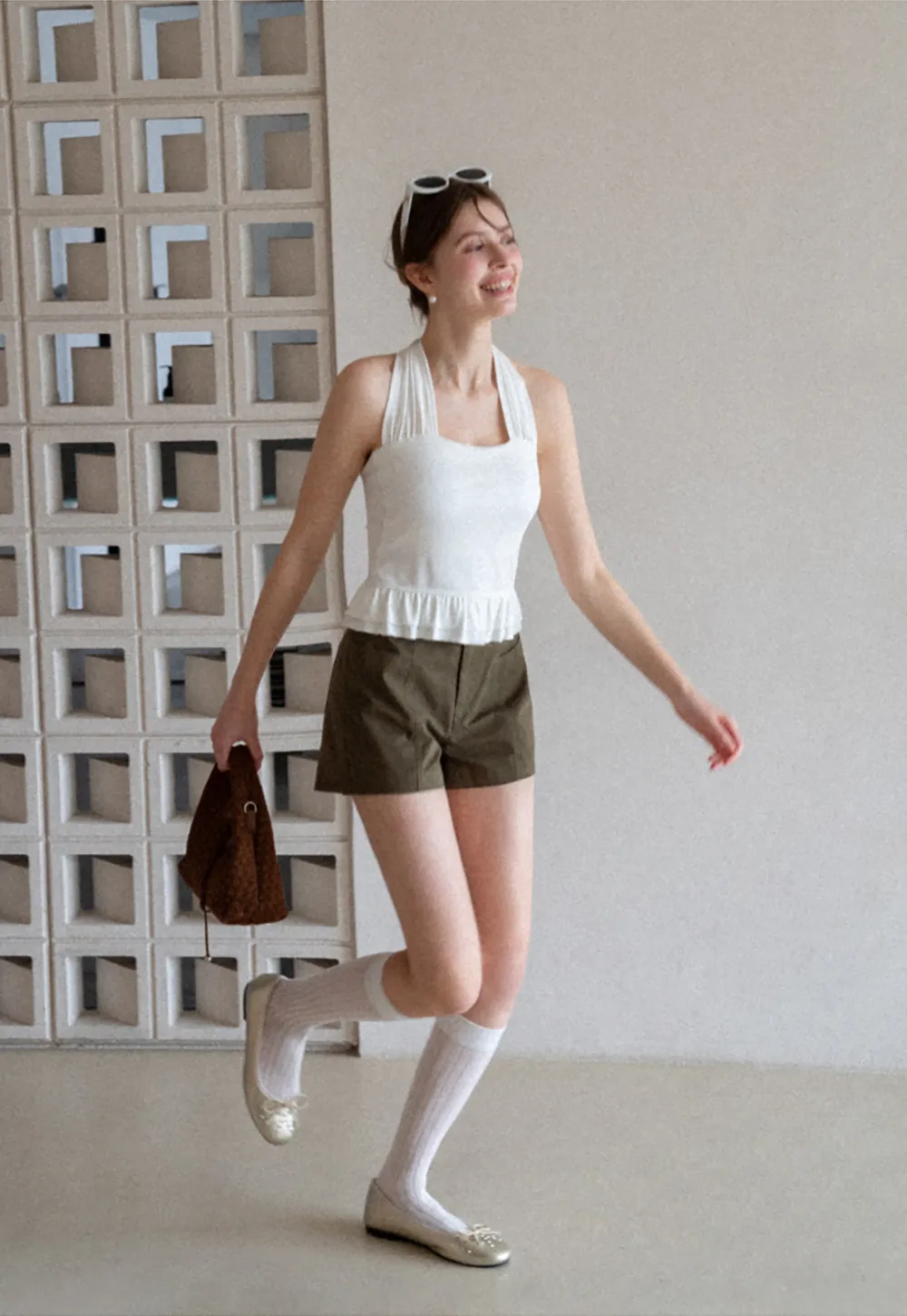 Halter neck tank top with ruffled hem