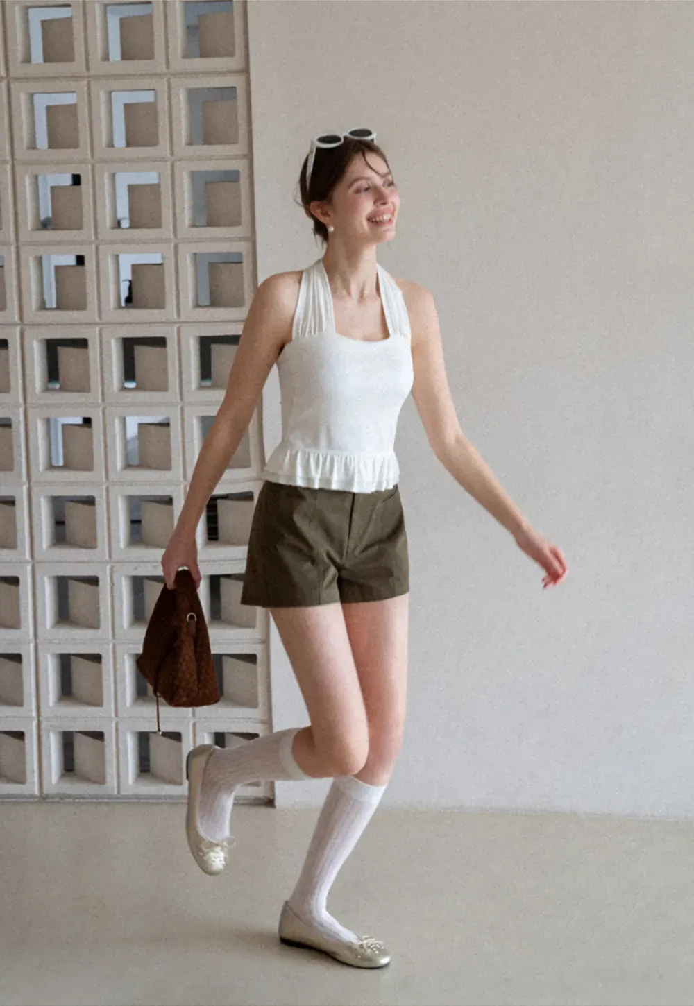 Halter neck tank top with ruffled hem