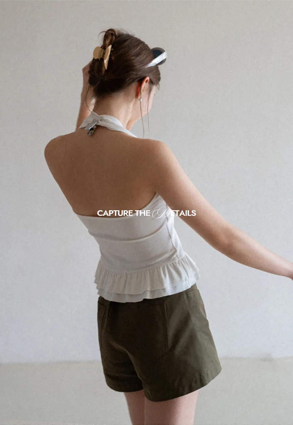 Halter neck tank top with ruffled hem