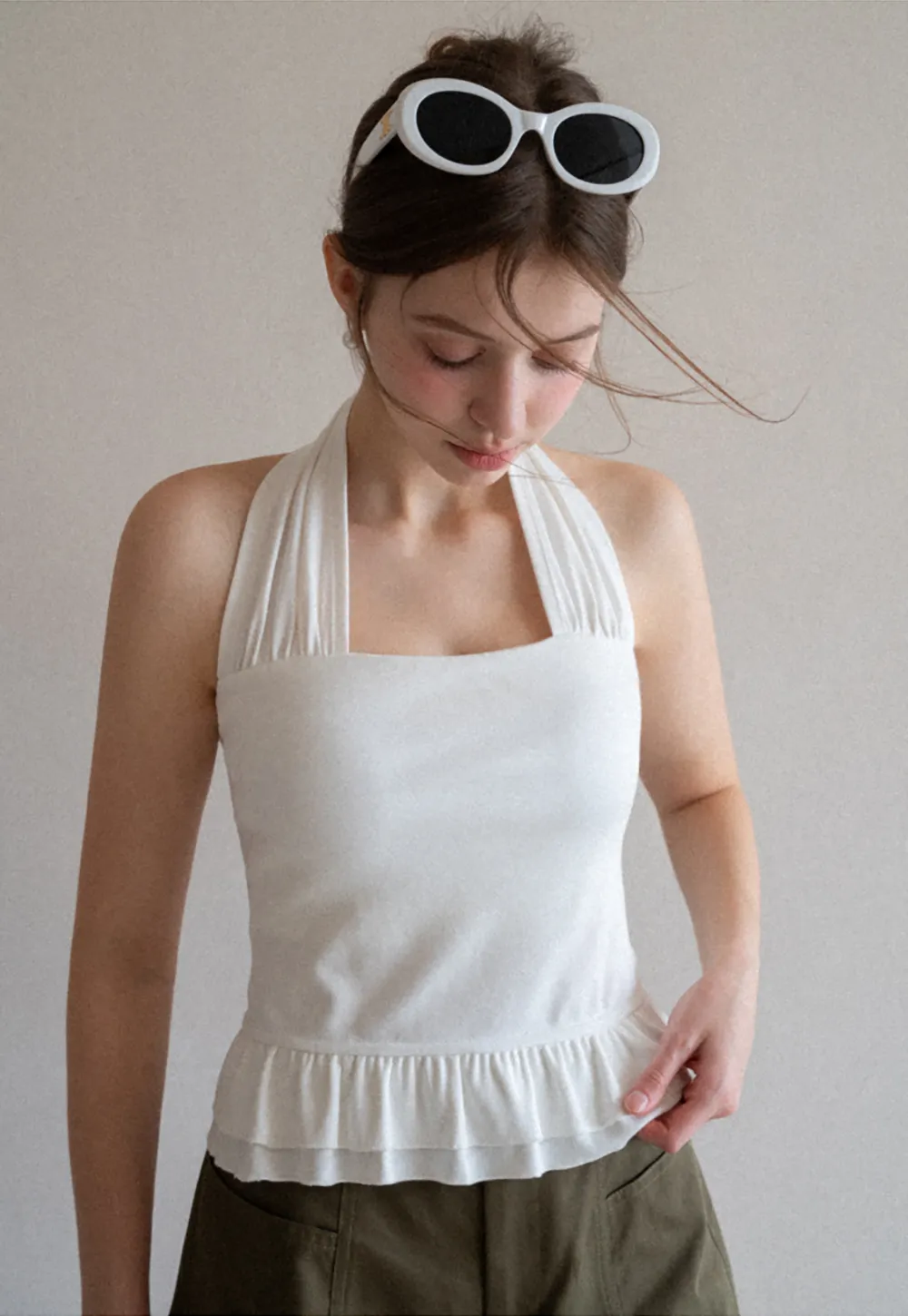 Halter neck tank top with ruffled hem