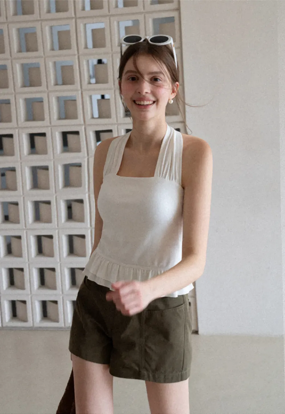 Halter neck tank top with ruffled hem