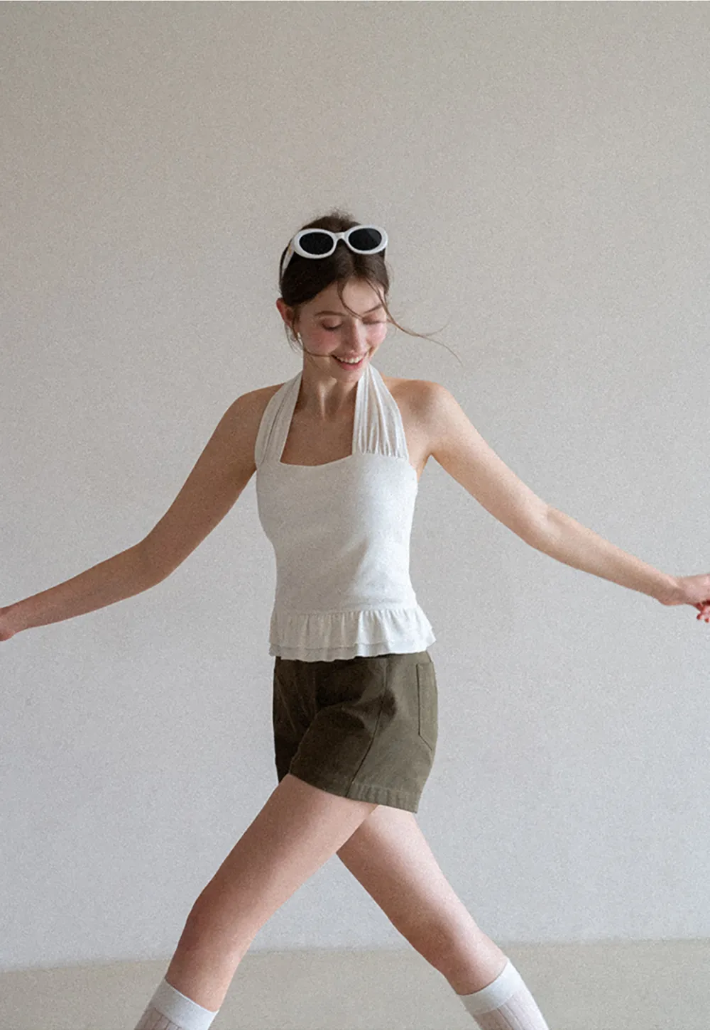 Halter neck tank top with ruffled hem