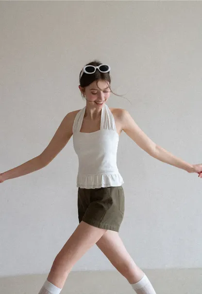 Halter neck tank top with ruffled hem