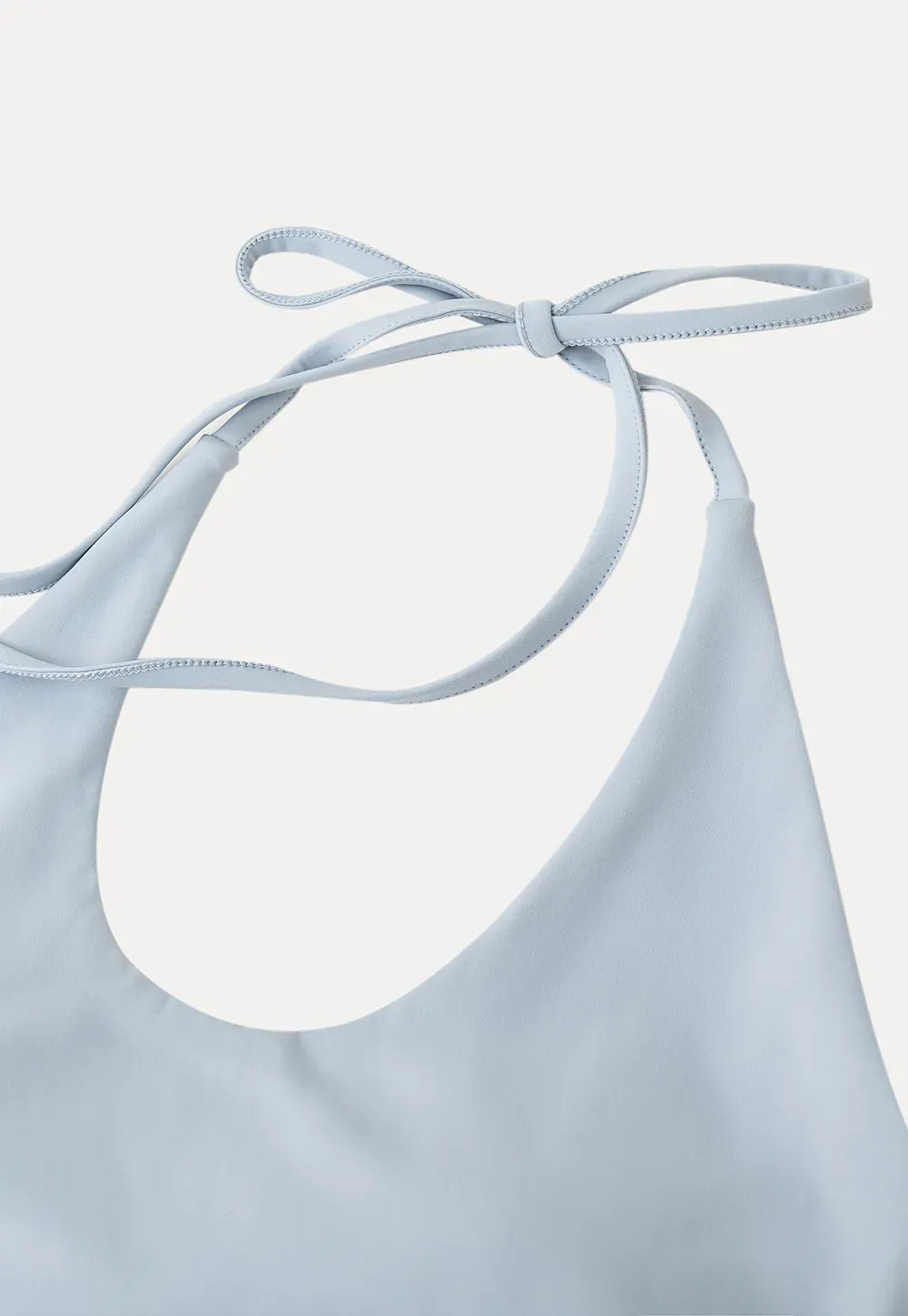 Crop tank top with halter neckline and thin straps