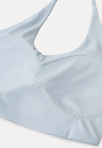 Crop tank top with halter neckline and thin straps