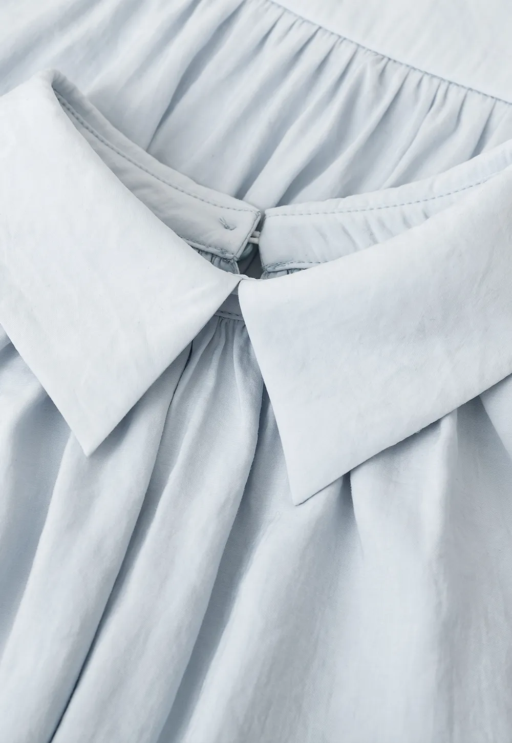 Collarless halter top with lace hem skirt