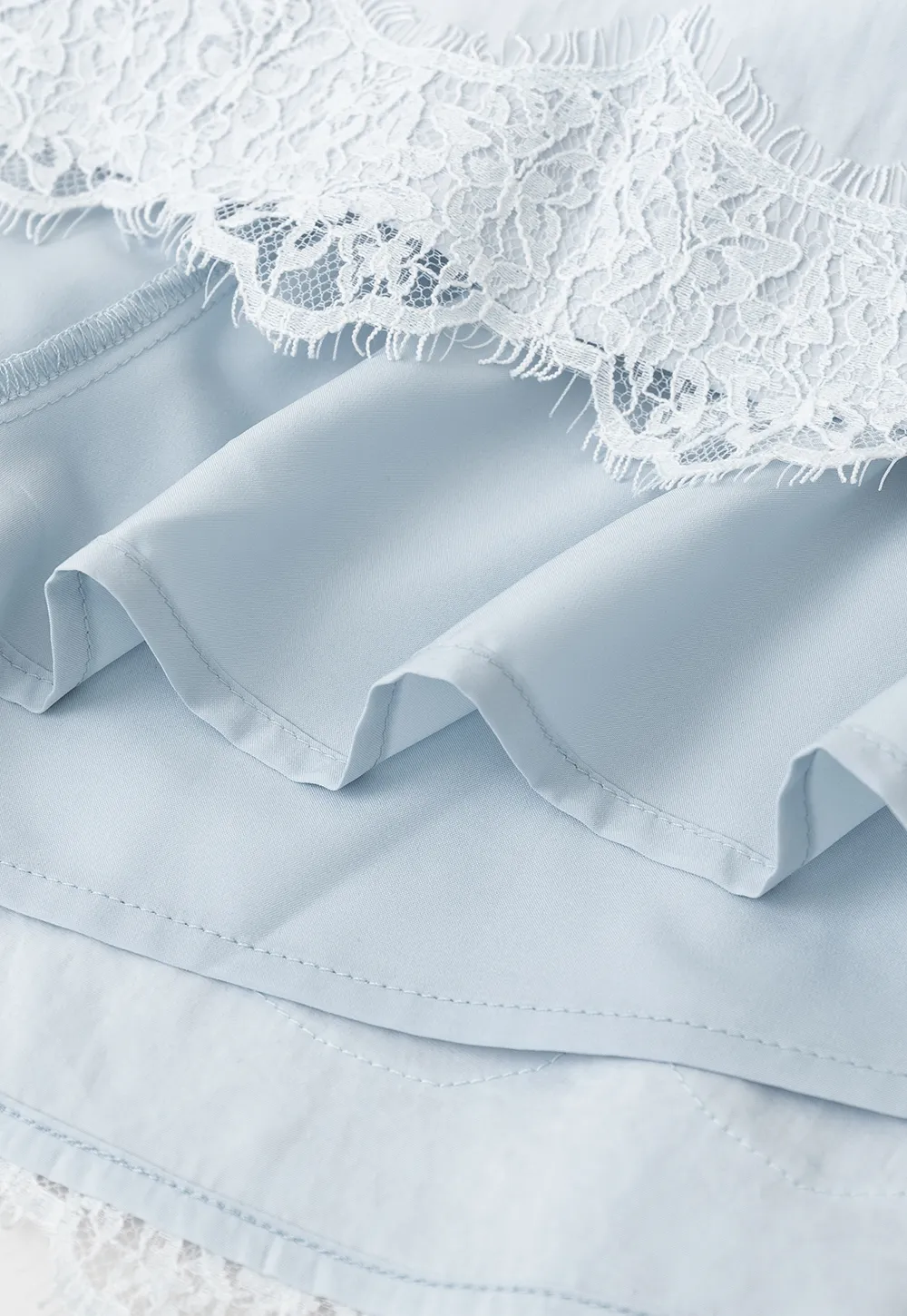 Collarless halter top with lace hem skirt